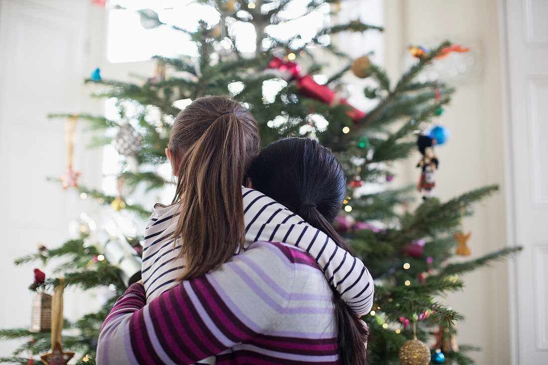 Mother and daughter hugging at Christmas