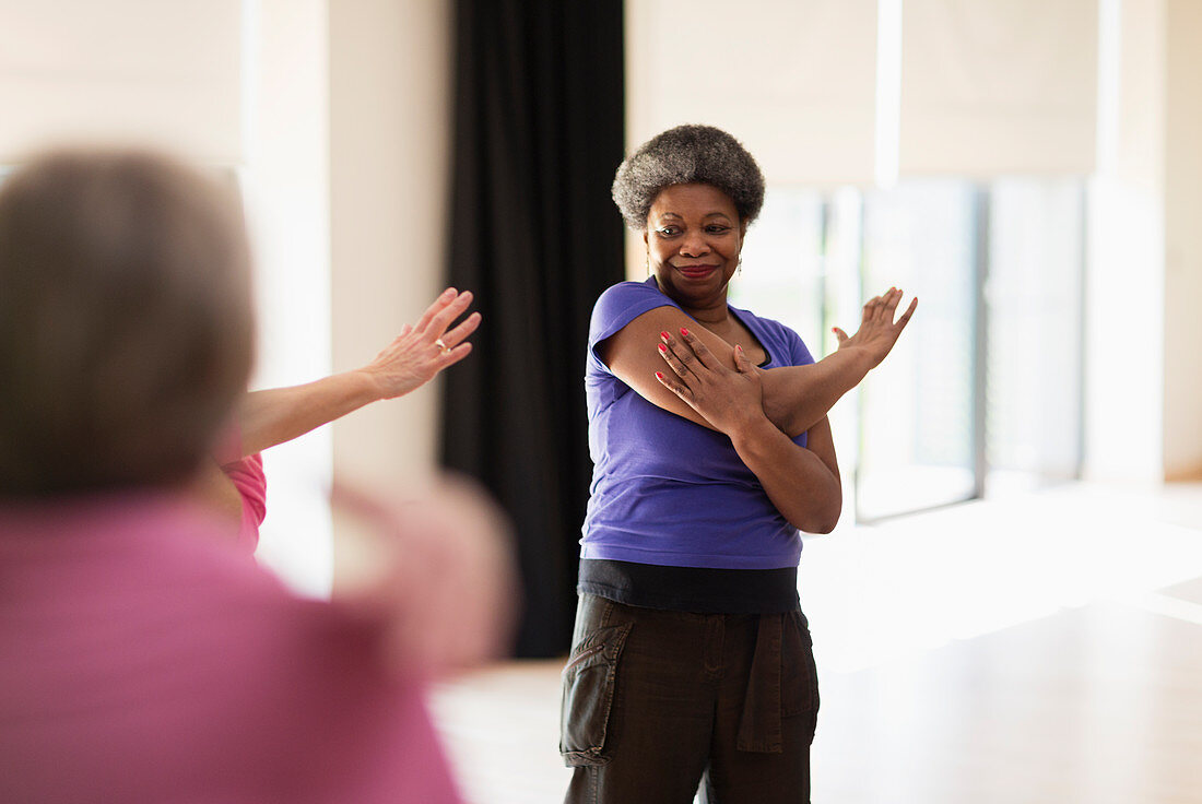 Active senior stretching arm