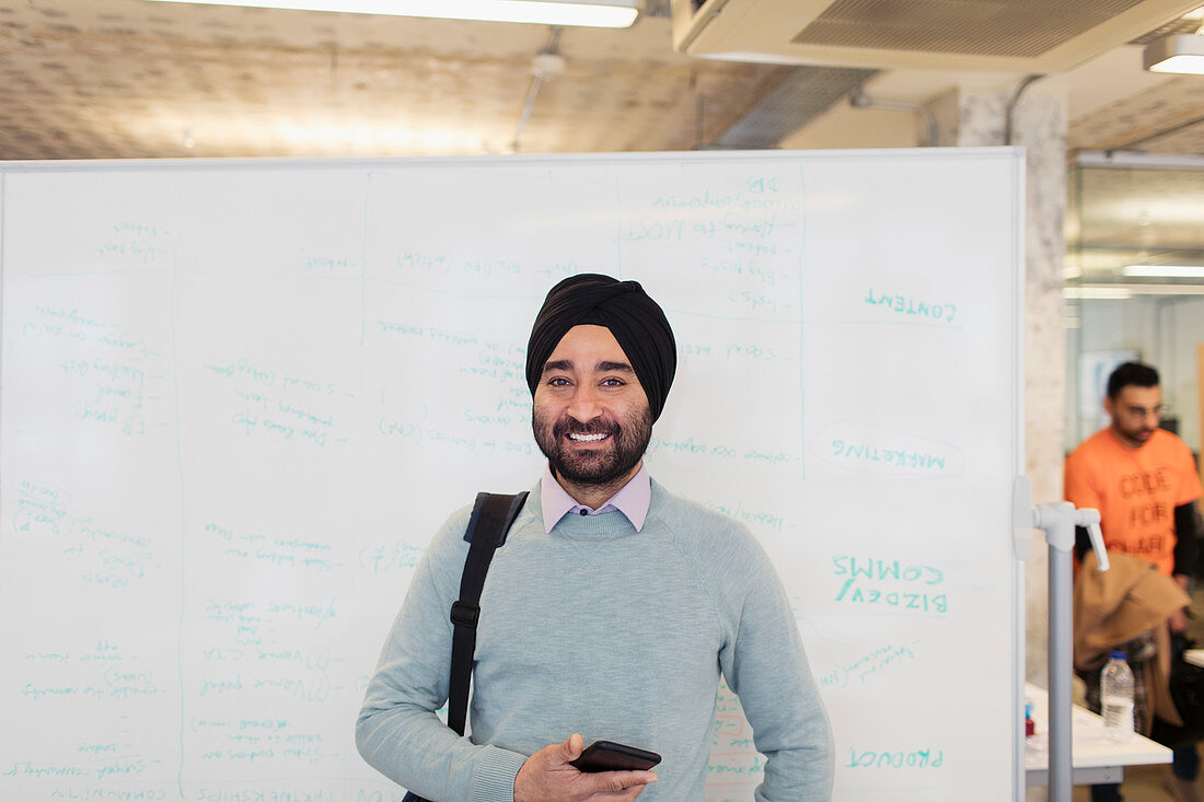 Portrait Indian businessman in turban standing