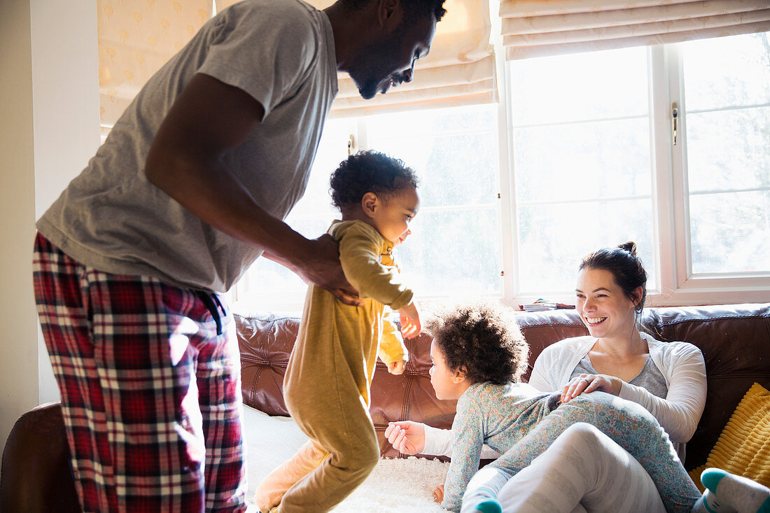 Playful multi-ethnic family in pyjamas