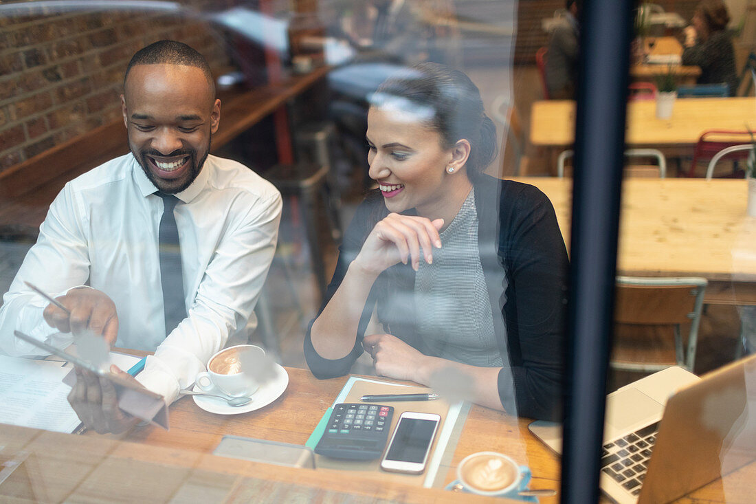 Business people working at cafe window