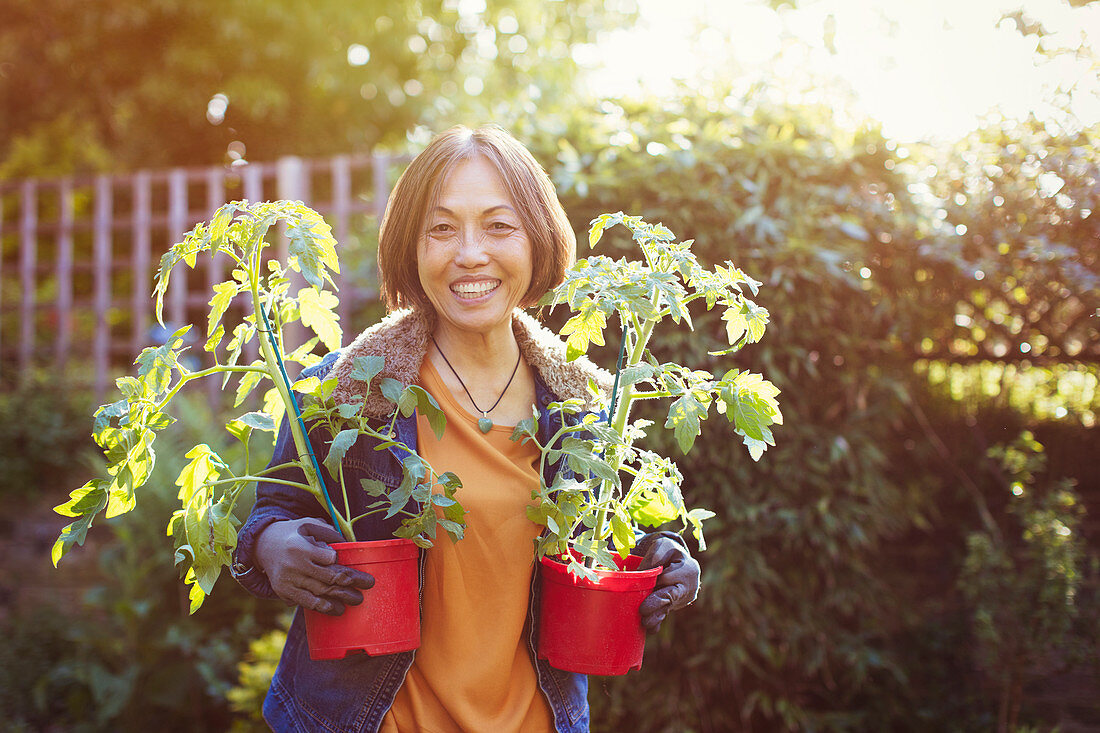 Portrait smiling, confident Senior woman gardening