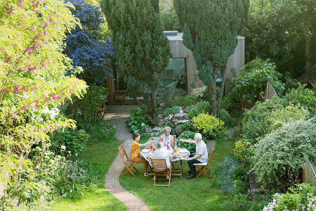 Senior friends enjoying garden party lunch