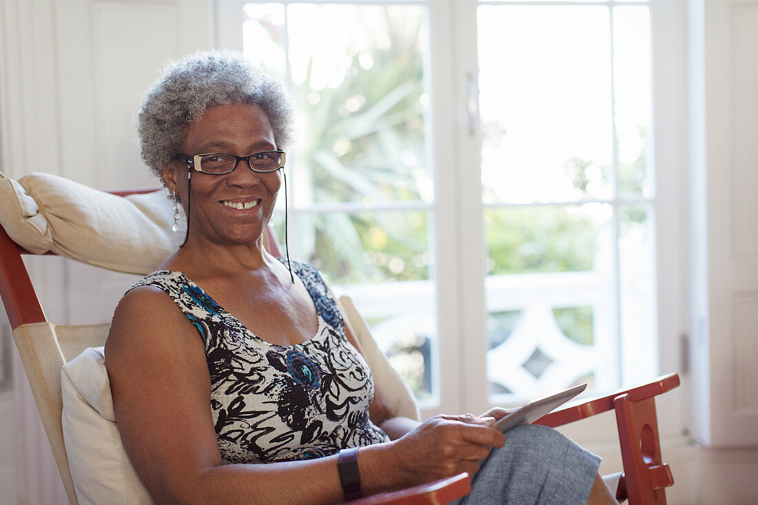 Portrait of senior woman using digital tablet