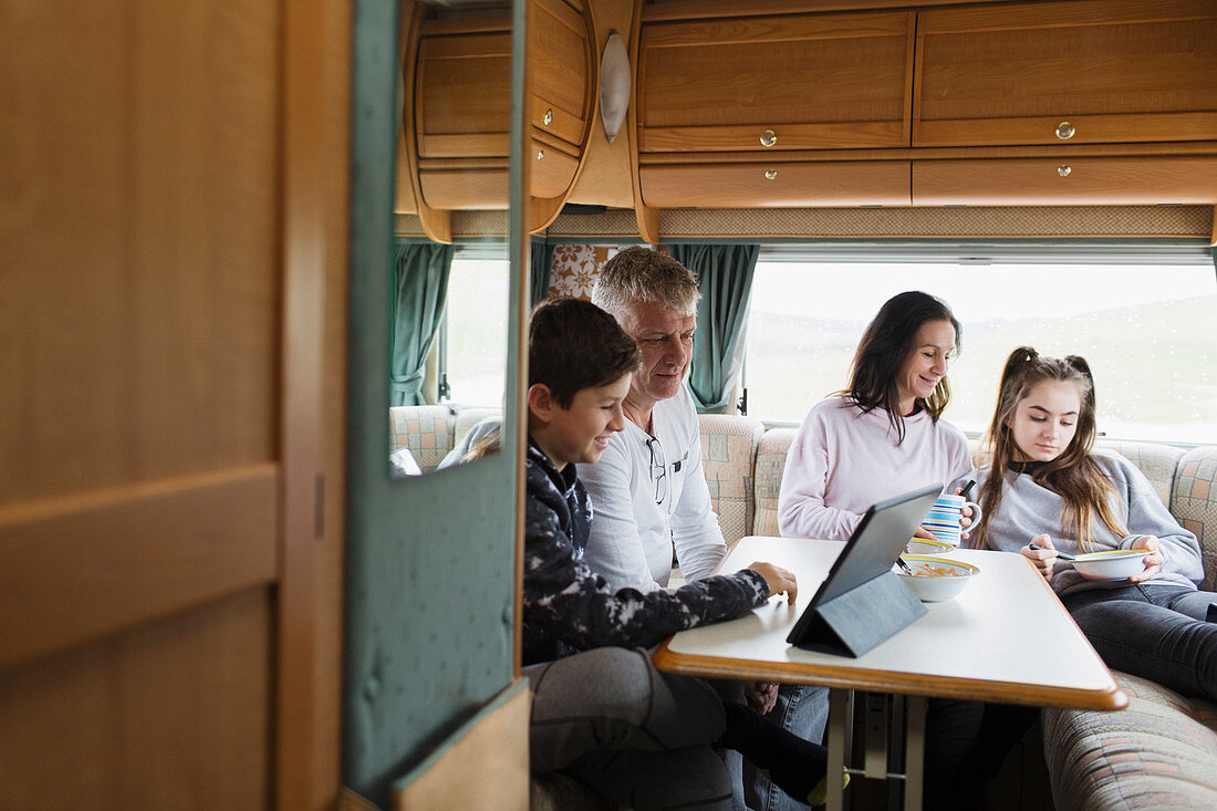 Family relaxing in motor home