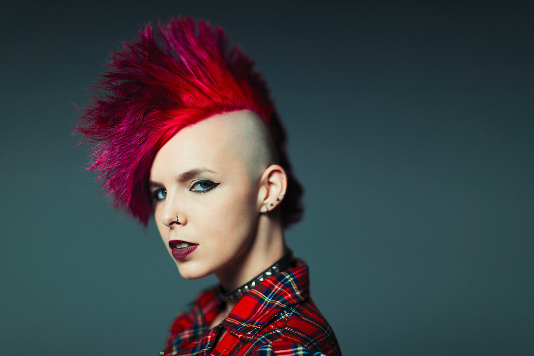 Portrait cool young woman with pink mohawk