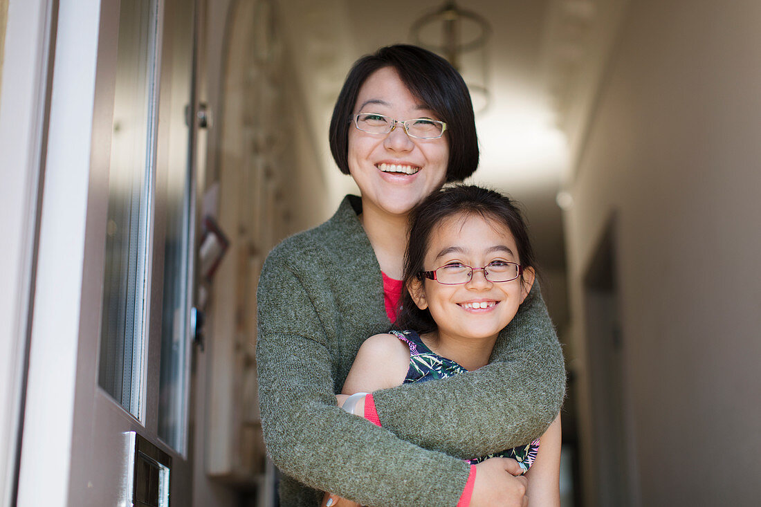 Portrait happy, mother and daughter hugging