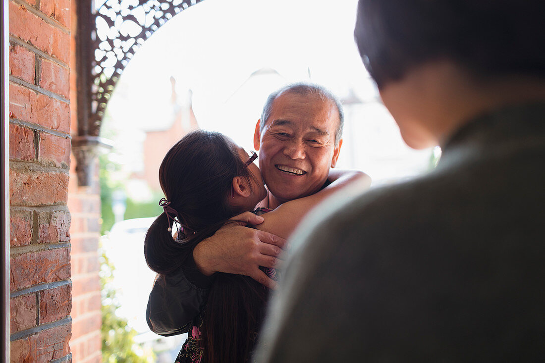 Granddaughter hugging granddaughter