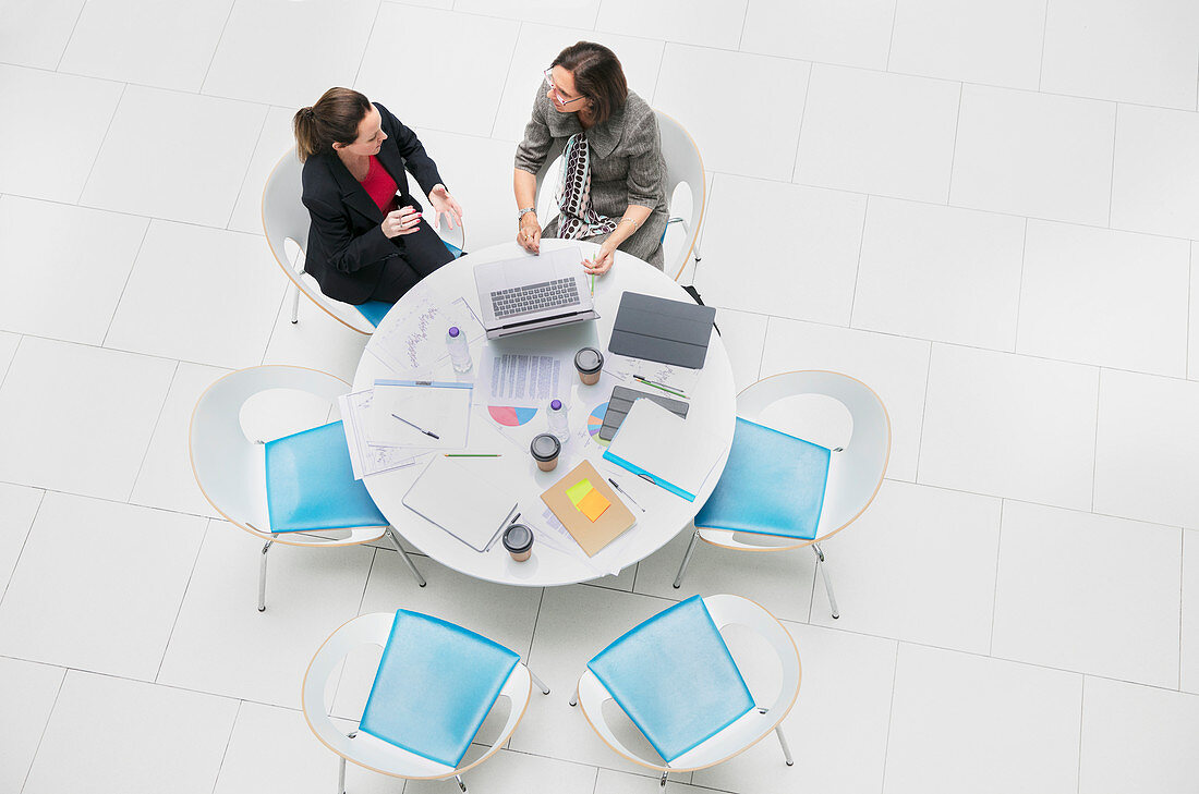 Businesswomen talking, meeting at round table