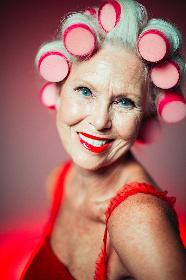 Senior woman with hair in curlers