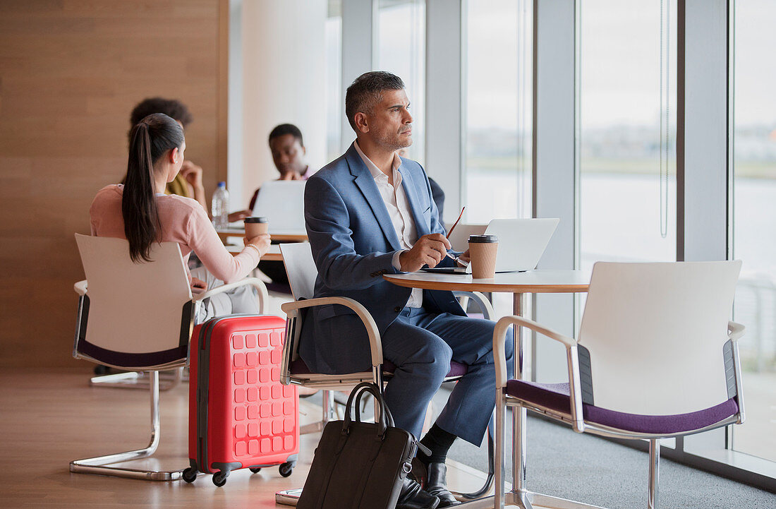 Thoughtful businessman in airport business lounge