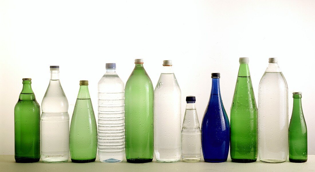 Several bottles of mineral water in a row