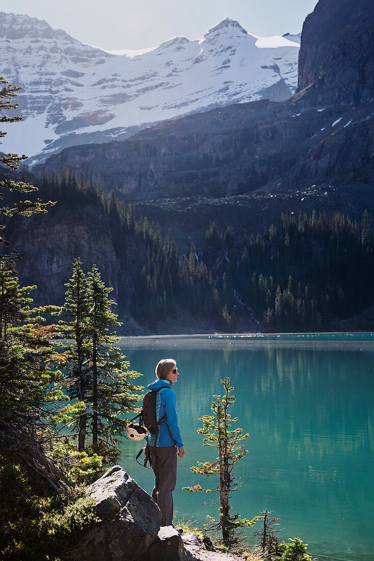Female hiker looking at lake view, Canada