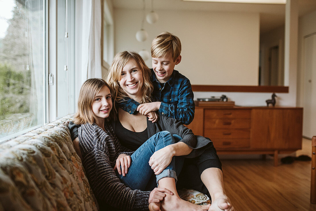 Portrait mother and children cuddling