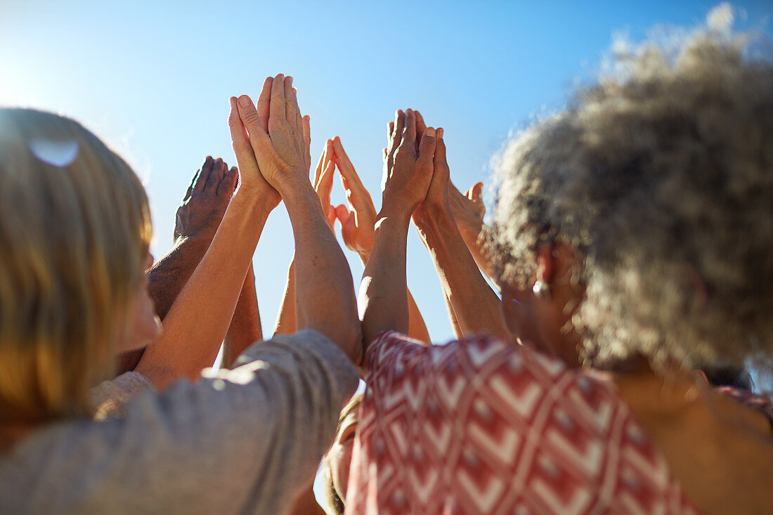 Group with hands clasped in circle