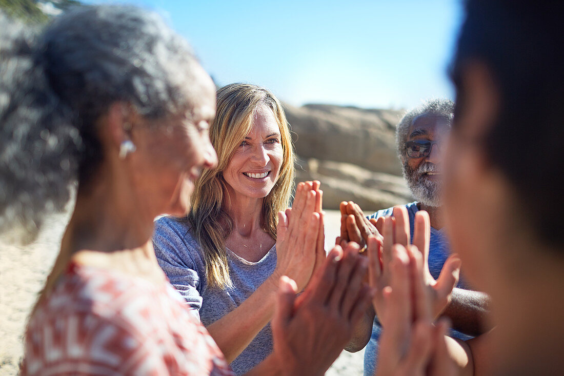 Friends with hands clasped in circle