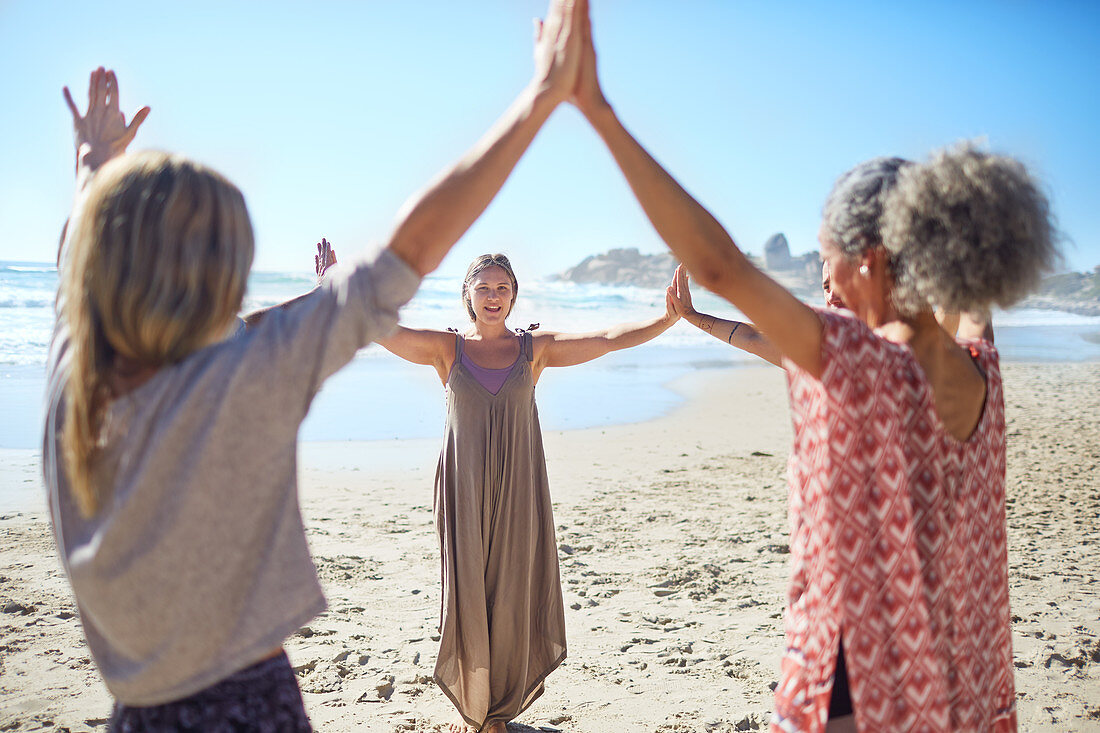 Women joining hands in circle