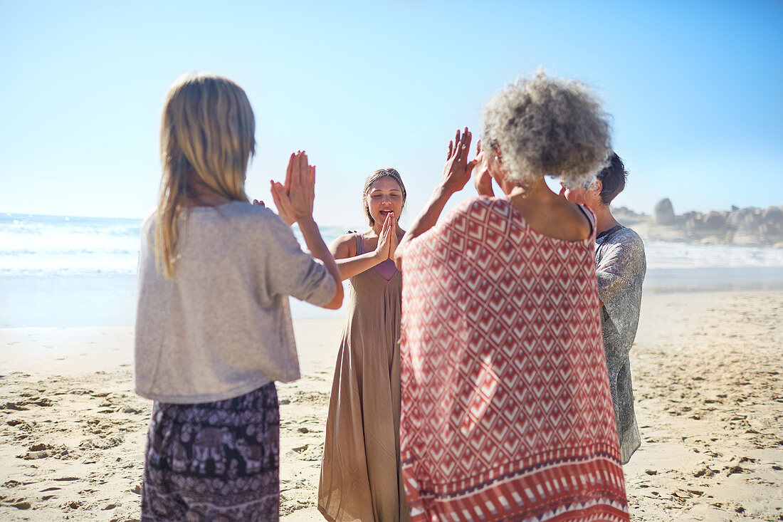 friends with hands clasped in circle