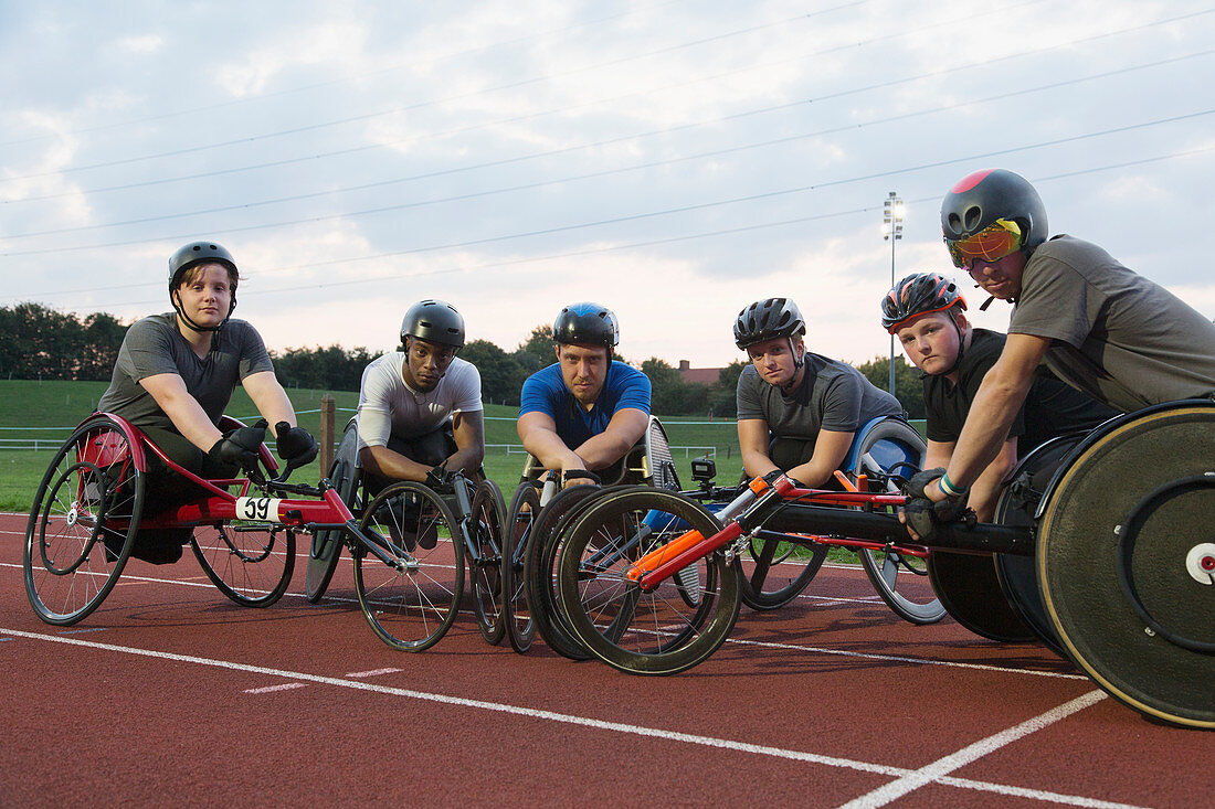 Portrait paraplegic athletes training for wheelchair race
