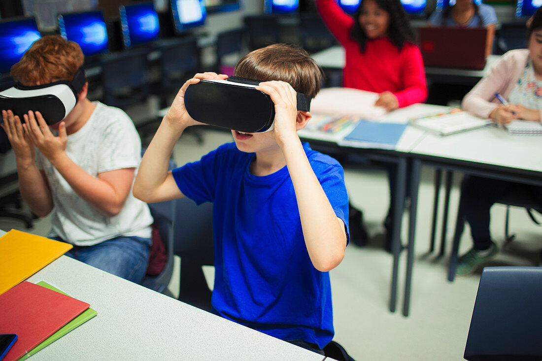 school boy students using virtual reality simulators