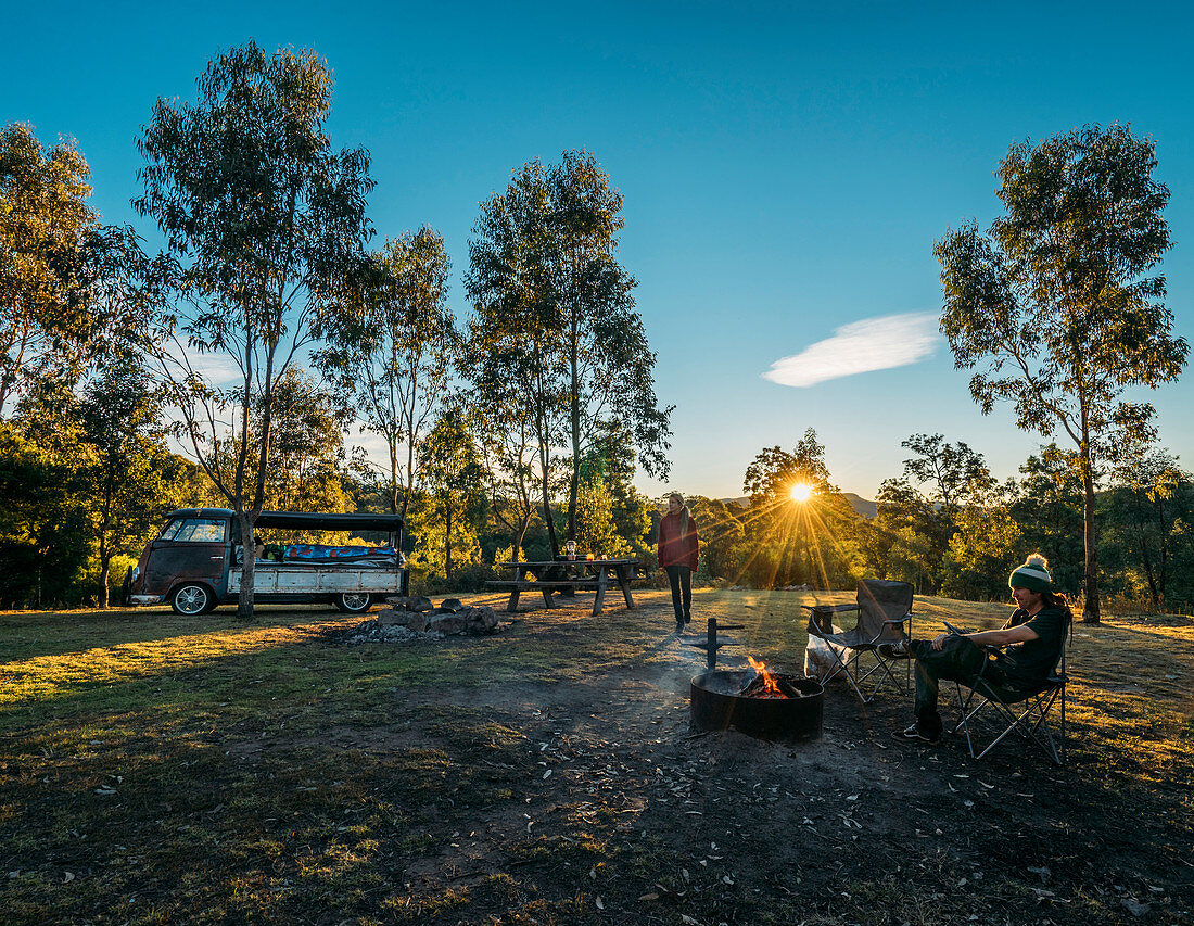 Couple camping in idyllic field, Blue Mountains, Australia