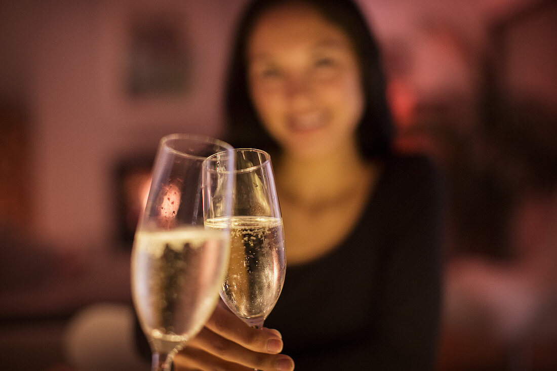 Personal perspective couple toasting champagne flutes