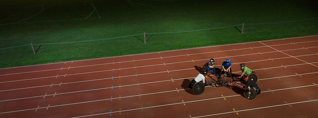 Paraplegic athletes huddling