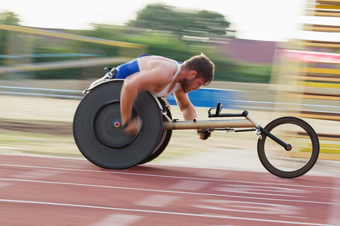 Determined paraplegic speeding in wheelchair race