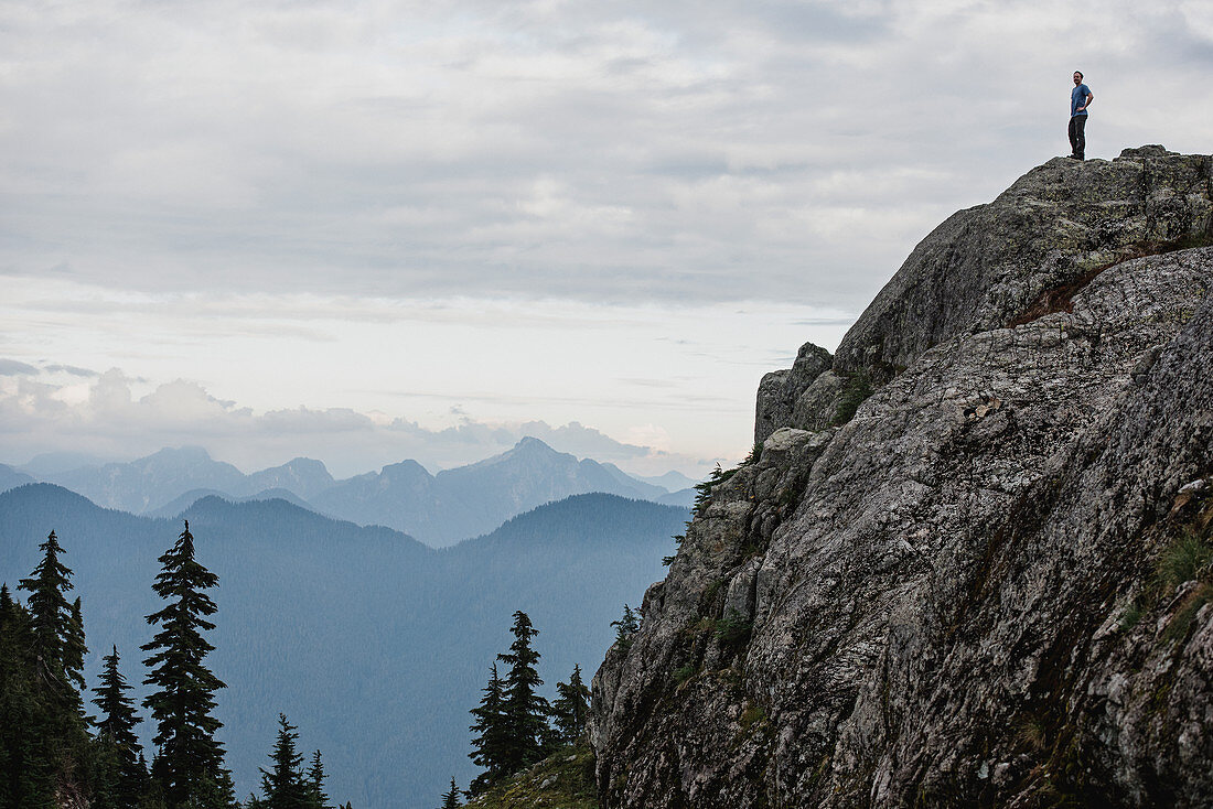 Male hiker standing on mountaintop, Canada