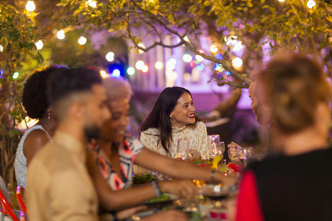 Friends enjoying dinner garden party