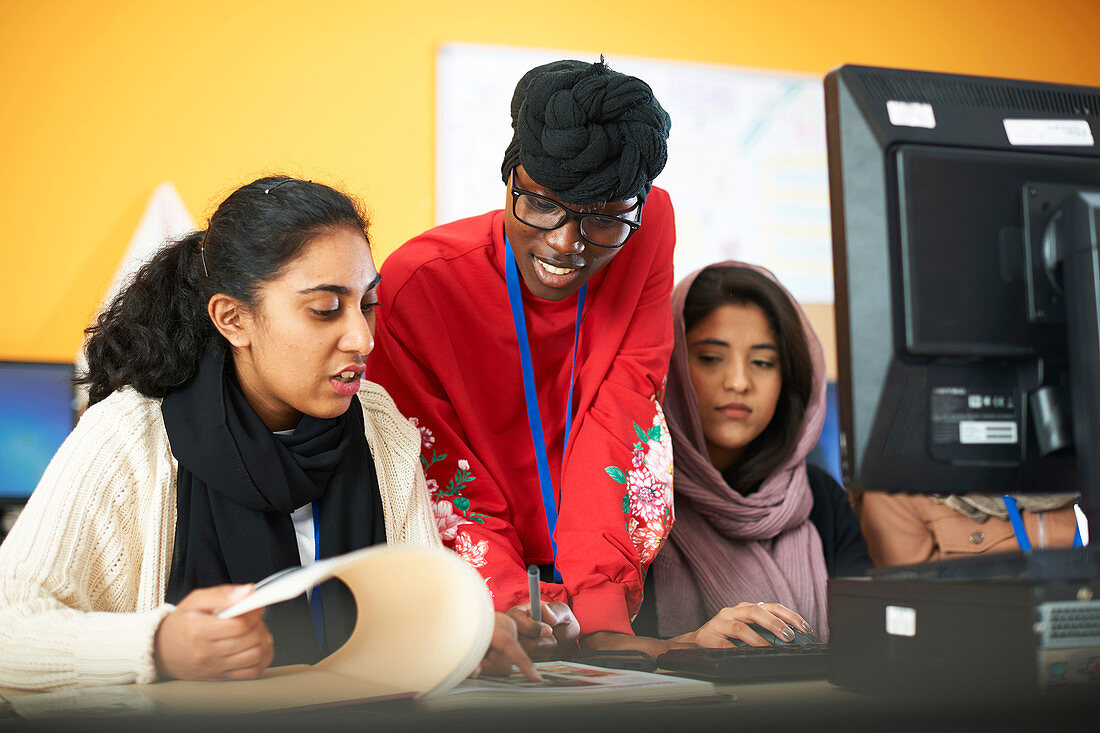 Female multi-ethnic college students using computer