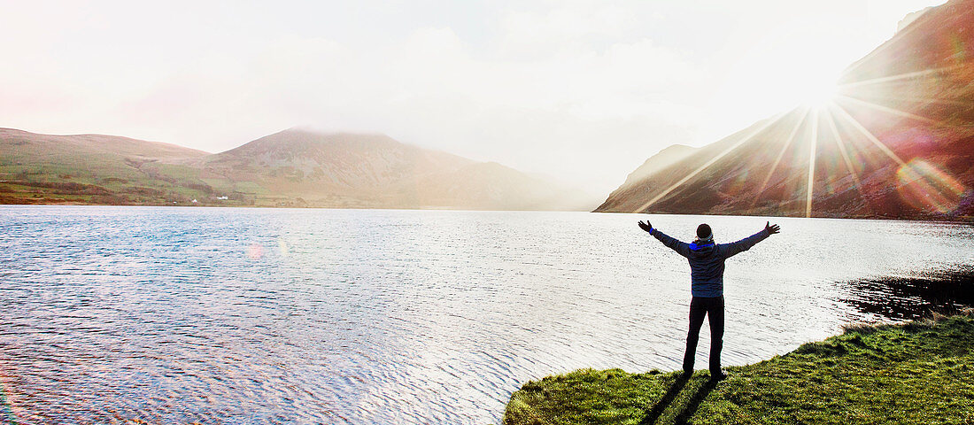 Excited man at lake