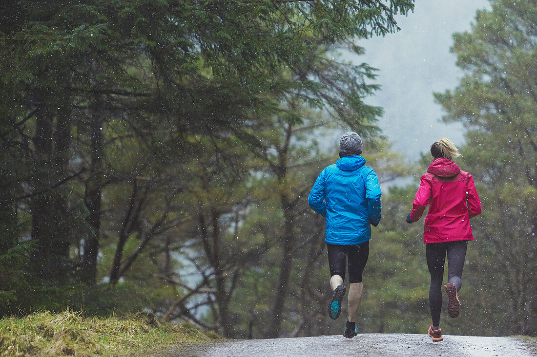 Couple jogging in woods