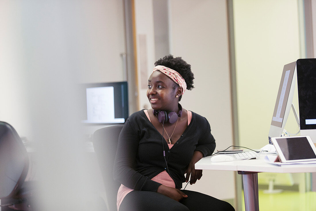 Smiling community college student using computer