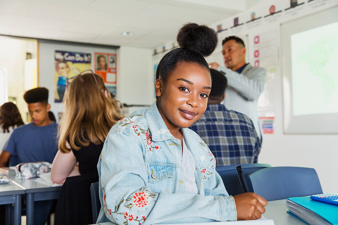 Portrait high school girl student studying in classroom