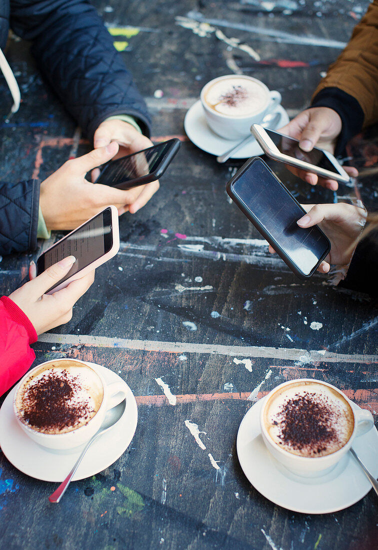 College students drinking cappuccinos