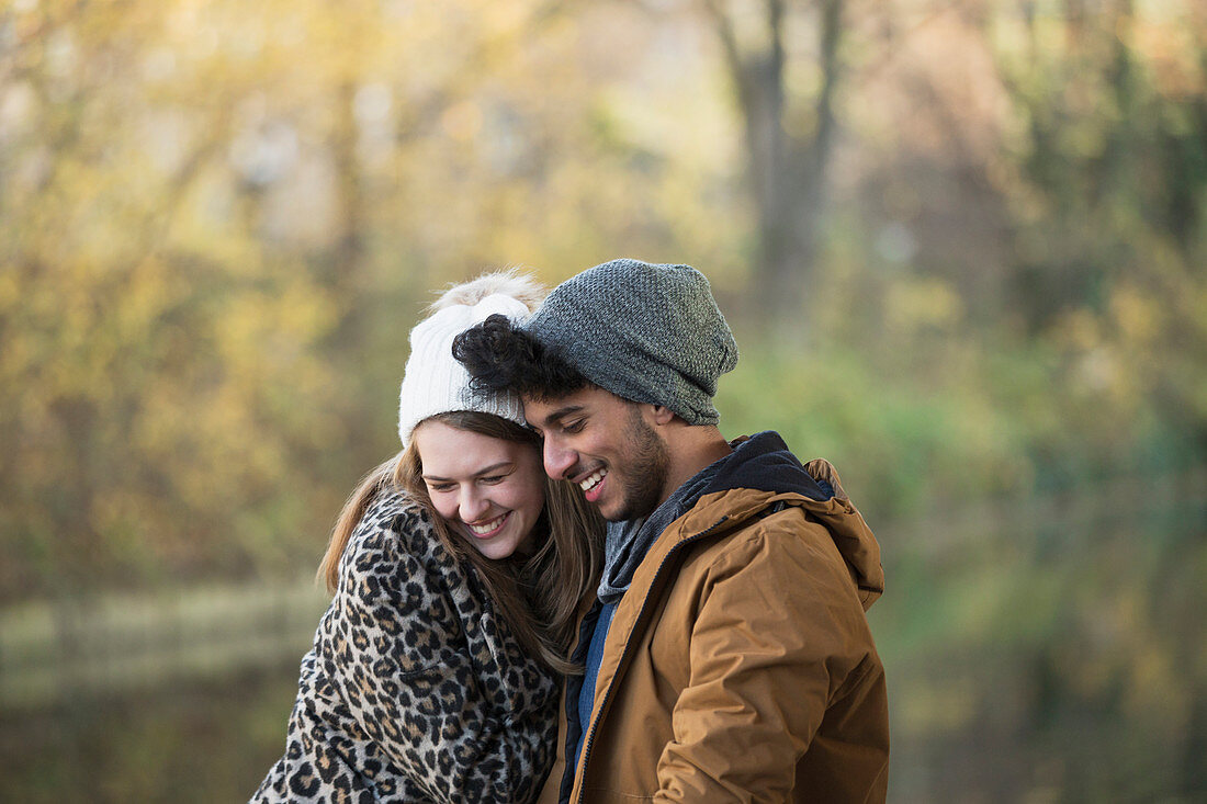 Affectionate young couple hugging outdoors