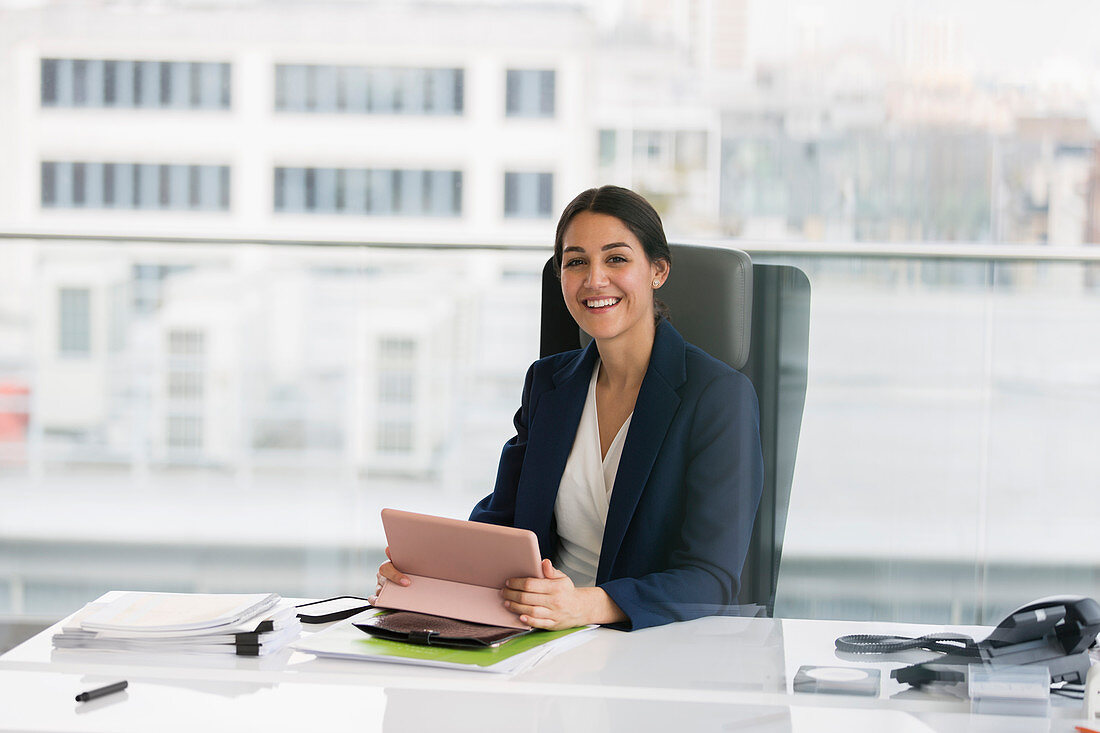 Portrait businesswoman with digital tablet in office