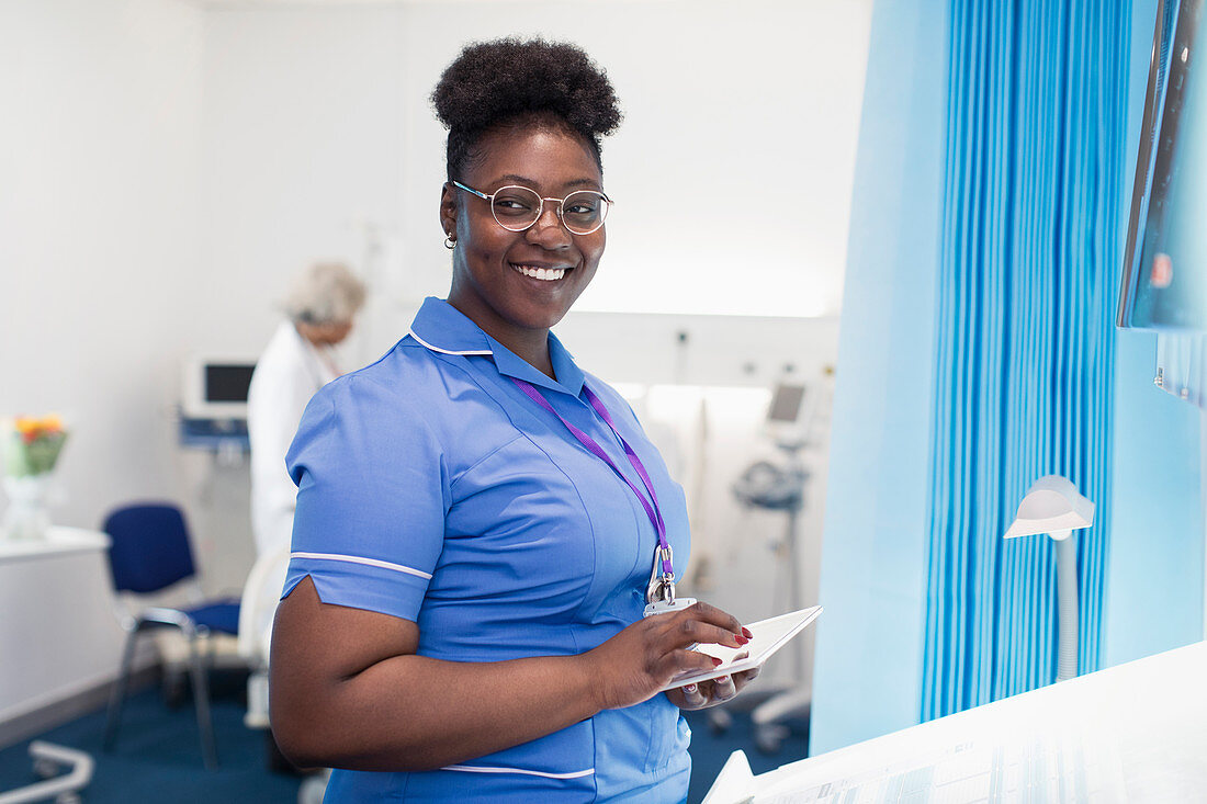 Portrait nurse using digital tablet in hospital room