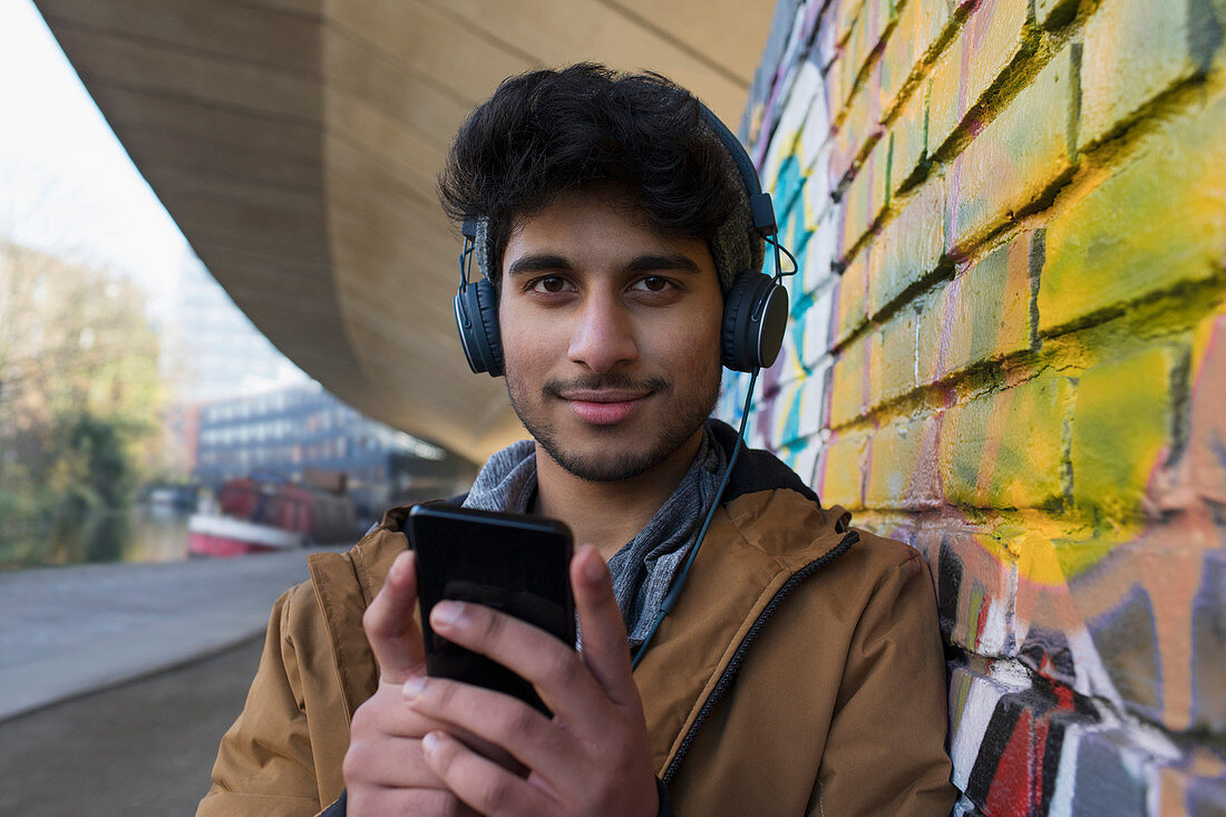 Man listening to music with headphones and mp3 player