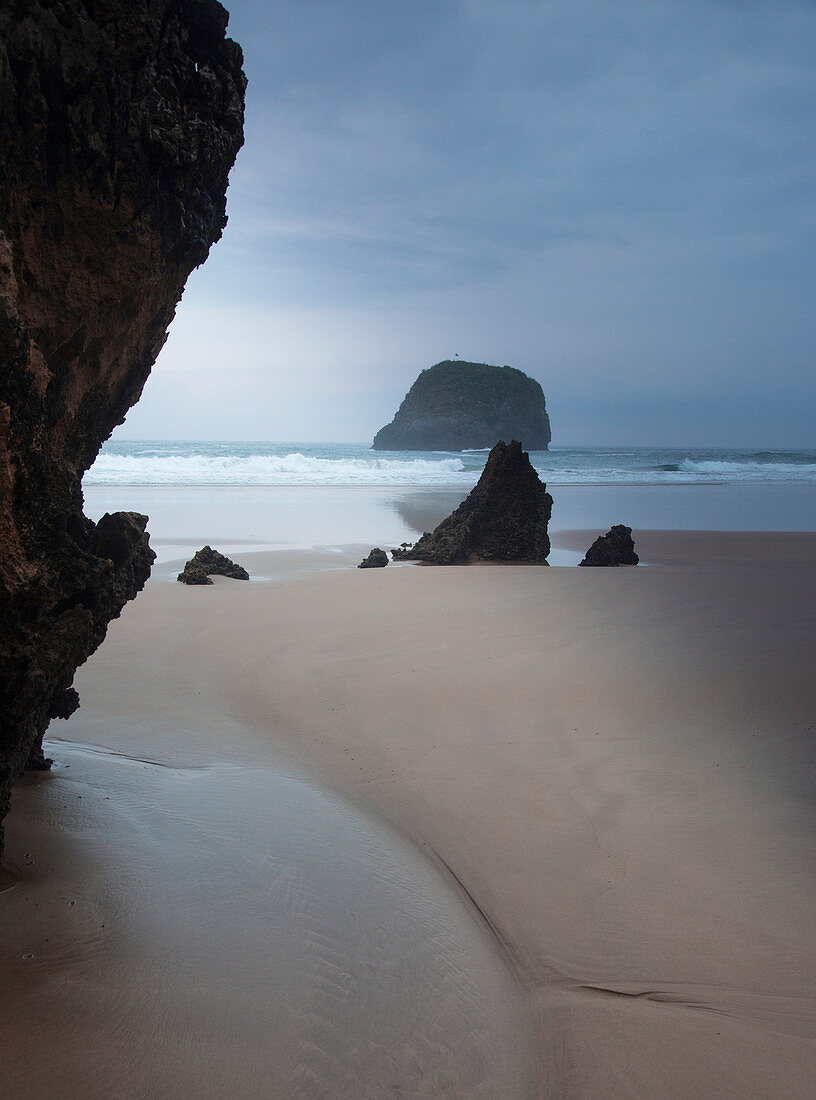 Rocks on tranquil ocean beach Borizo Beach Asturias Spain