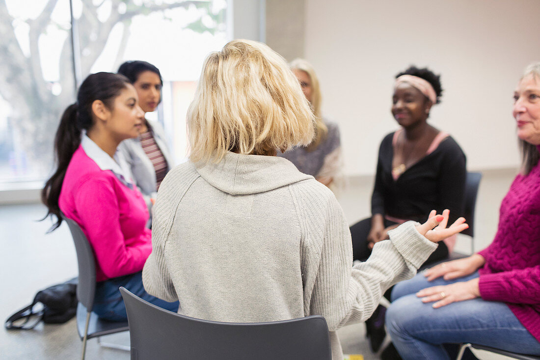 Women's support group talking in circle