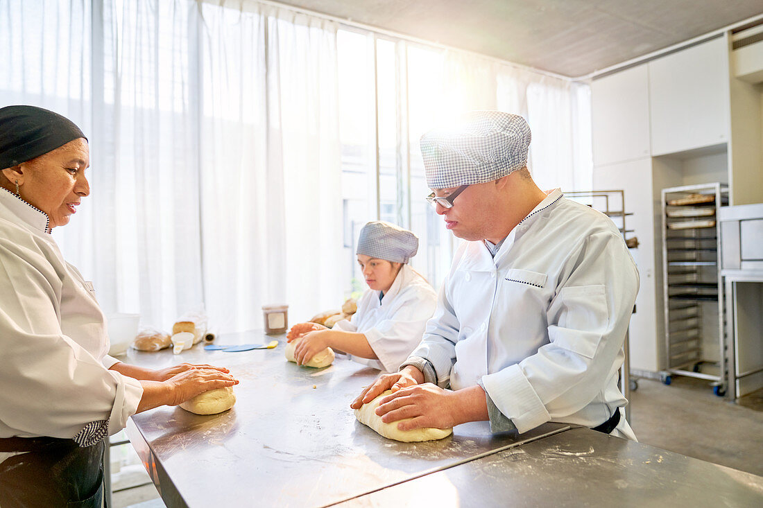 Chef teaching students with Down Syndrome how to bake