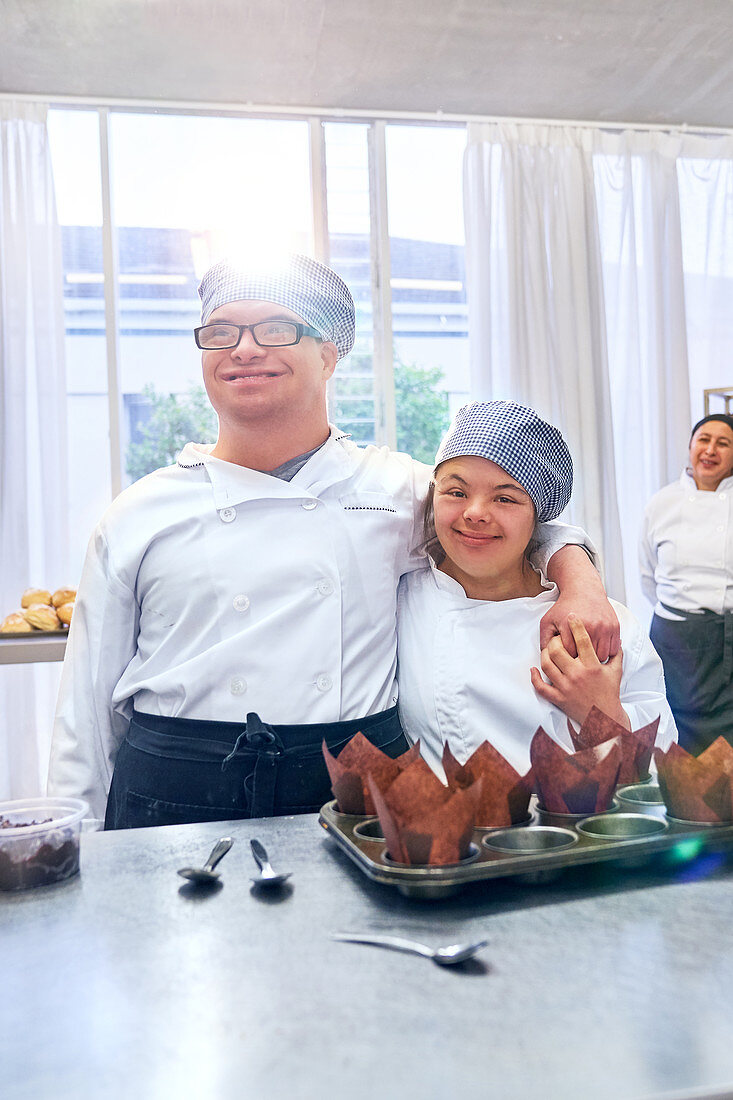 Portrait happy students with Down Syndrome in baking class