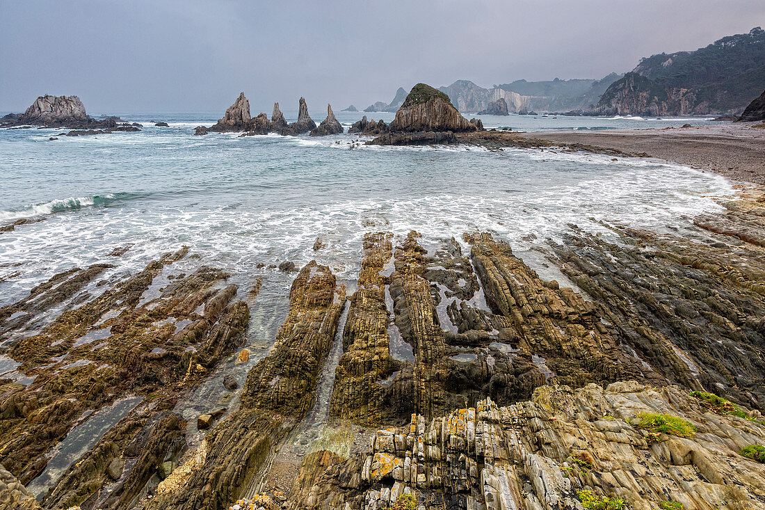 Tranquil rocky ocean beach Gueira Beach Asturias Spain