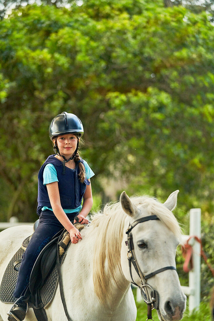 Portrait girl horseback riding