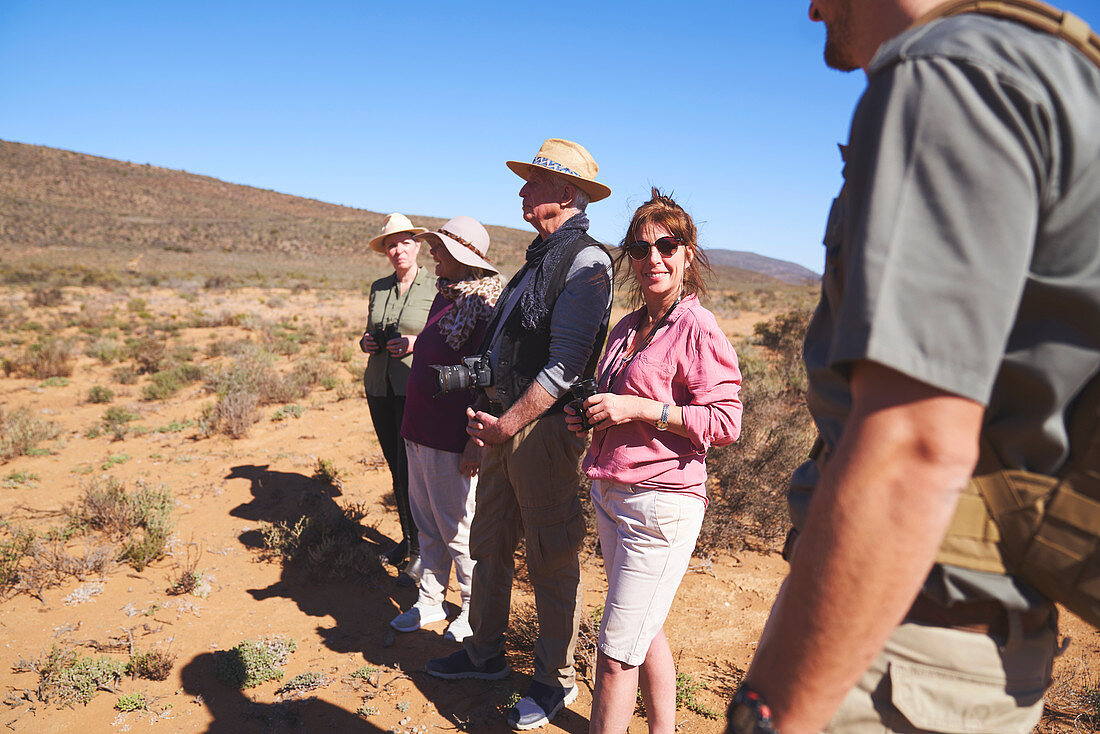 Happy woman enjoying safari with friends South Africa