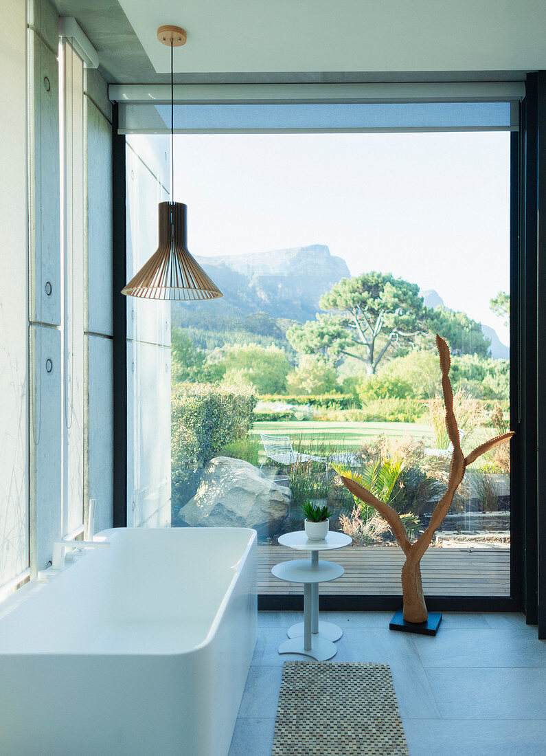 Modern, luxury bathroom with soaking tub and scenic view