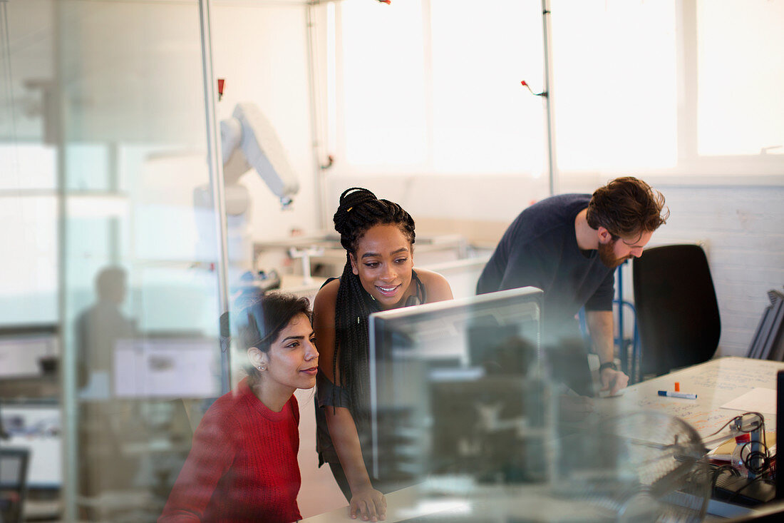 Engineers working at computer in office