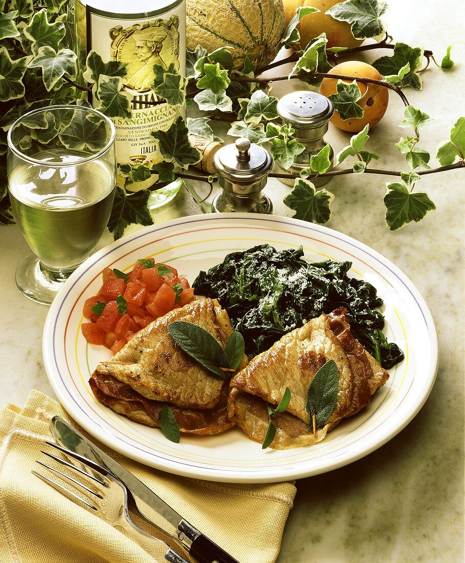 Saltimbocca (veal with ham, sage) with spinach & tomatoes